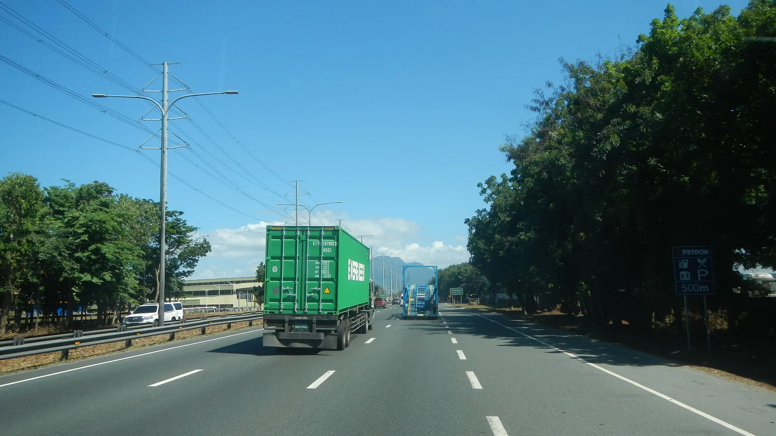 Container truck on a highway, the road freight used to import from Oman to UAE under the GCC customs union