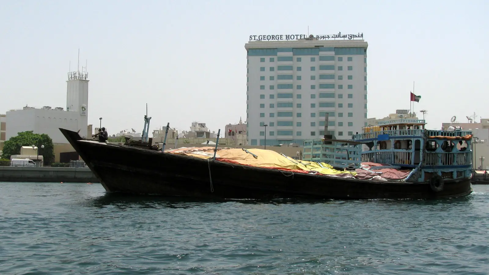Cargo-laden dhow on Dubai Creek, a traditional route for re-export Dubai trade