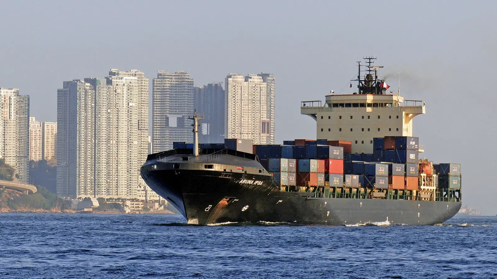 Container ship loaded with containers sailing near Hong Kong, a typical vessel used for shipping from China to Dubai